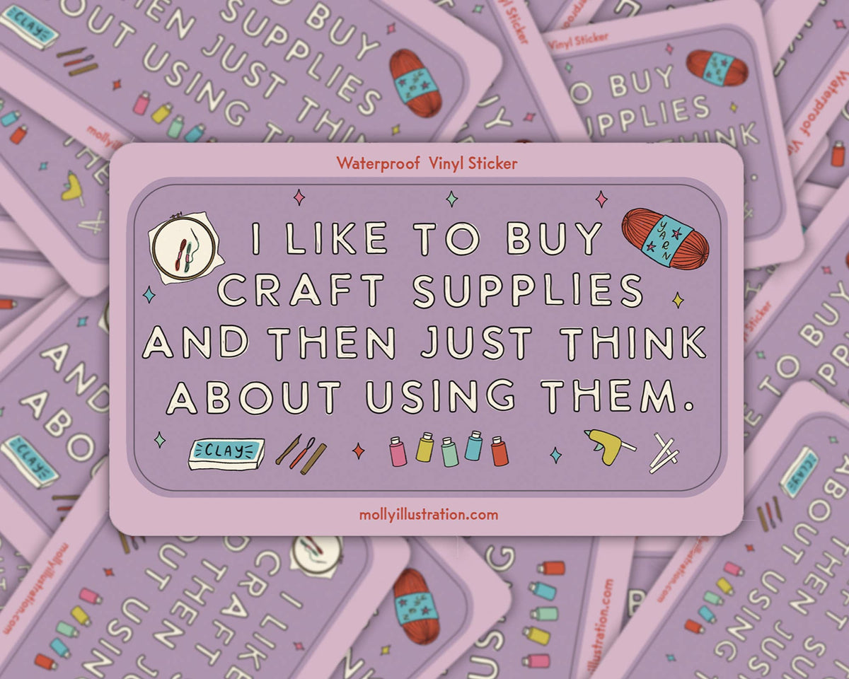Lavender Molly Illustration sticker reading "I like to buy craft supplies and then just think about using them" with yarn, clay and a glue gun