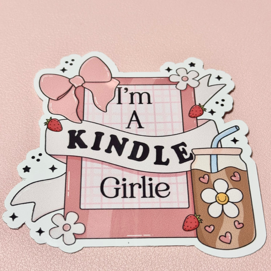 Die-cut sticker reading "I'm a Kindle Girlie" with a pink e-reader, bow, strawberries and an iced coffee