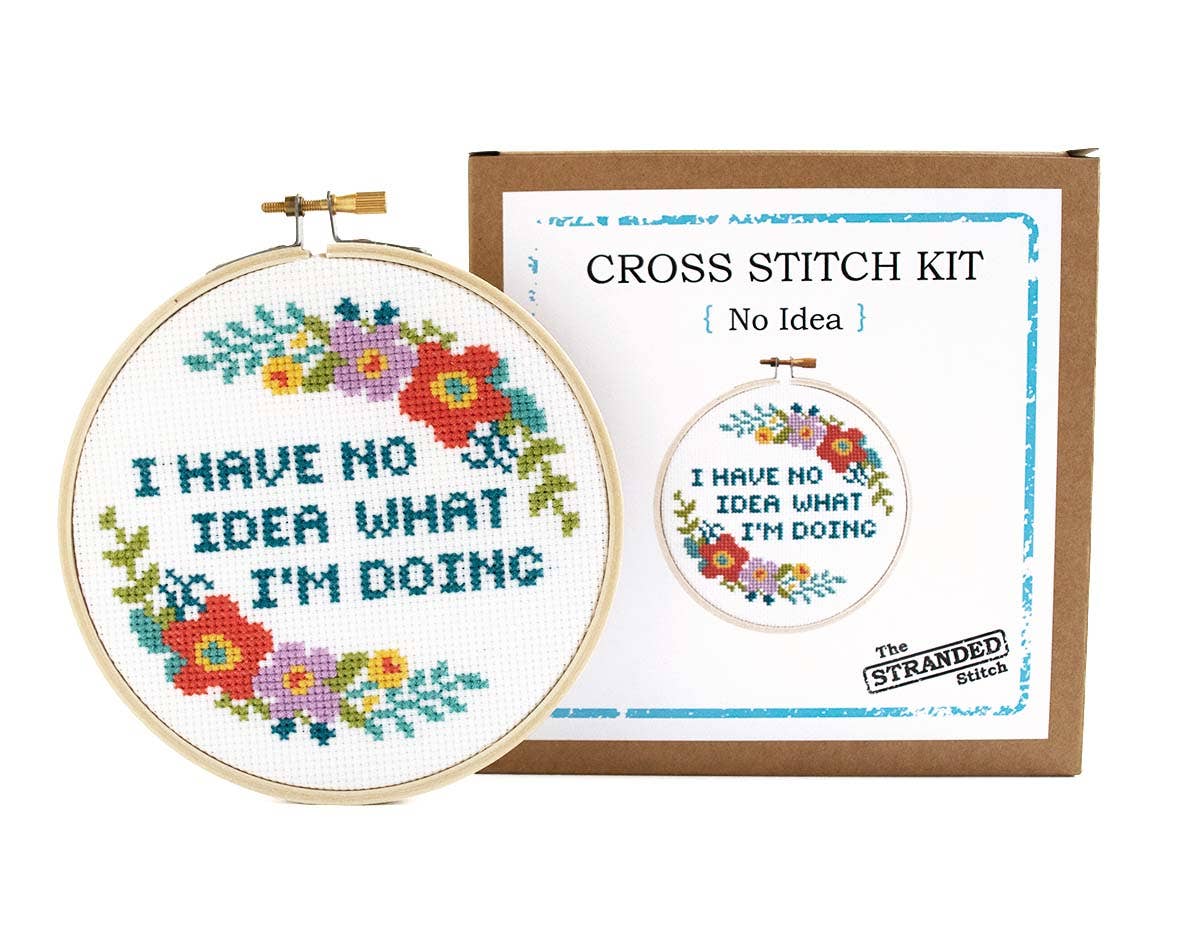 "I have no idea what I'm doing" cross stitch hoop beside The Stranded Stitch No Idea kit box