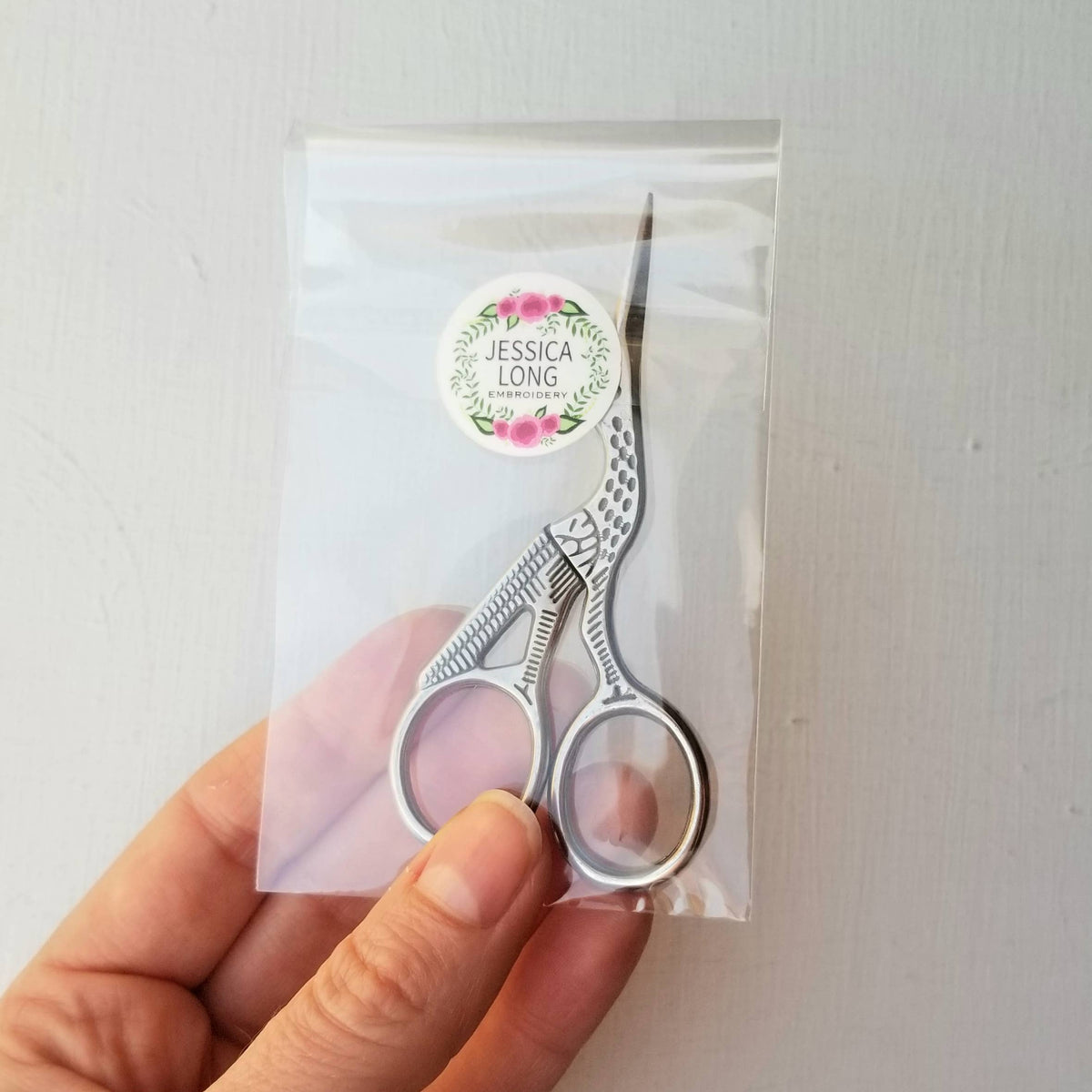 Stork embroidery scissors in a clear Jessica Long Embroidery bag