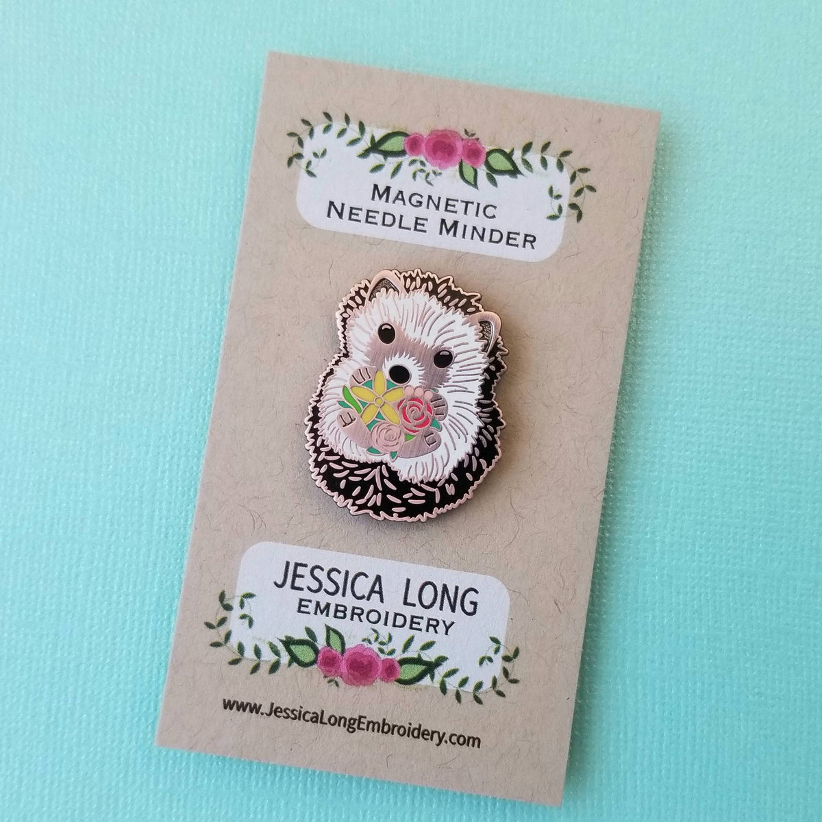 Hedgehog magnetic needle minder by Jessica Long Embroidery on its backing card