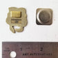 Back of the sea otters needle minder and its magnet, shown against a ruler for size