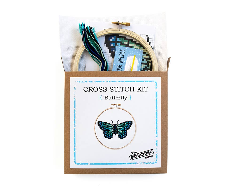 Kit contents in the box: hoop, white fabric, blue and green floss, needle and pattern