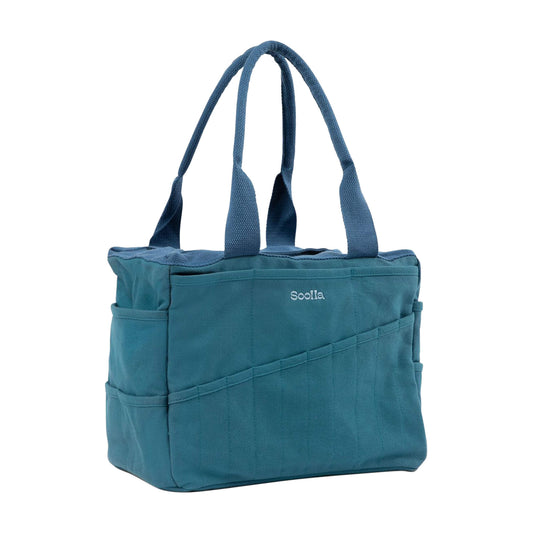Aquamarine canvas craft bag with blue handles and slanted front tool pockets