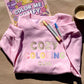 Pink Cozy Coloring Club crewneck with pastel lettering, markers and a Color Me Comfy coloring book