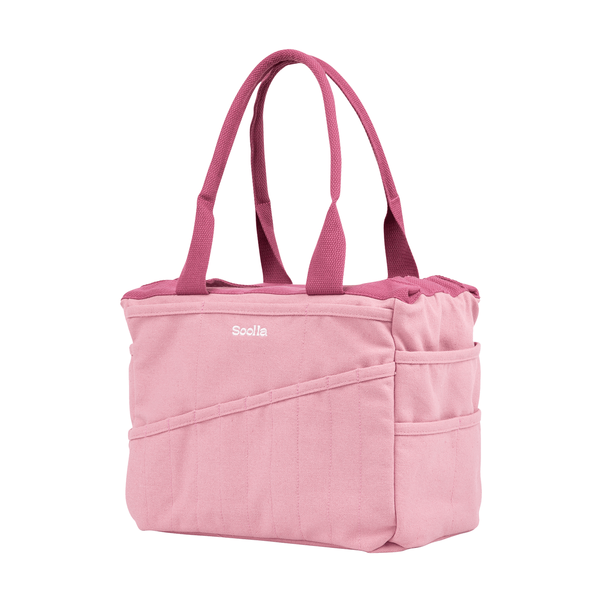 Angled view of the dusty pink Soolla craft bag with raspberry handles