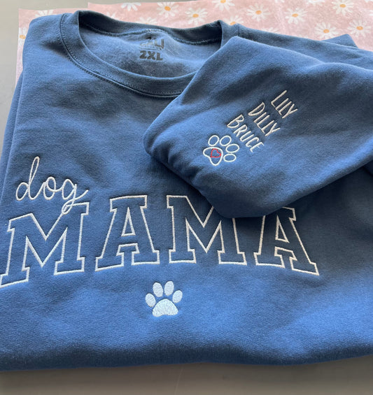 Blue dog MAMA crewneck with white embroidered lettering and paw print; sleeve personalized with the pet names Lily, Dilly and Bruce