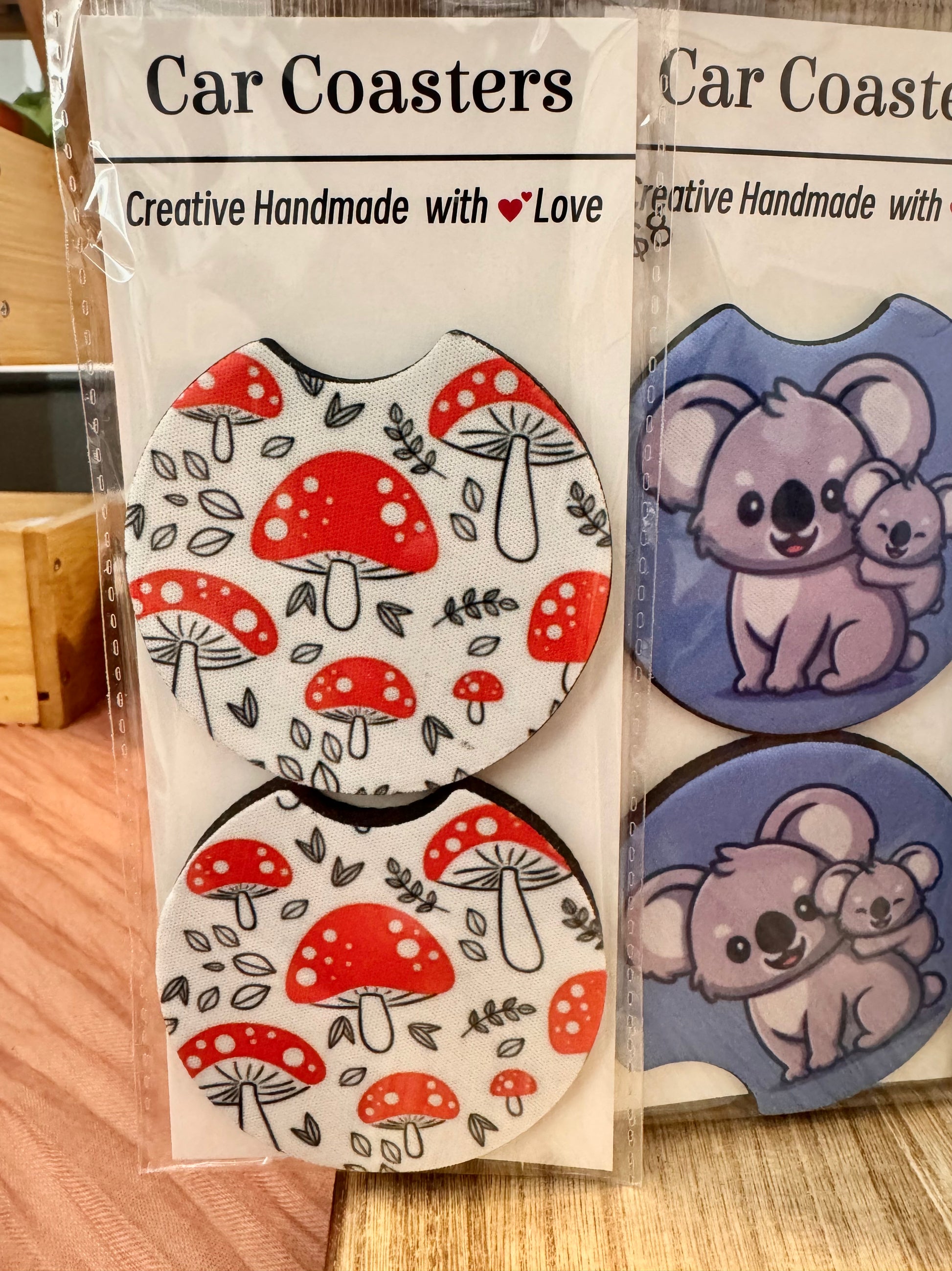 Two car coaster packs: red and white toadstool pattern, and blue with a mother and baby koala