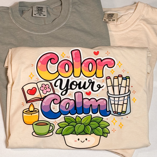 Folded cream Color your Calm T-shirt with a colorful coloring-themed print, beside sage and ivory tees