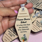 Hand holding a tan motel-style keychain reading "Pioneer Service School, It's the life that we choose; For Jehovah we live"