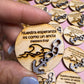 Engraved wood tokens with an anchor and waves and "Nuestra esperanza es como un ancla" (Hebreos 6:19)