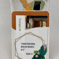 Phone card wallet with a gold geometric frame, teal flowers and the Salmos 56:3 quote