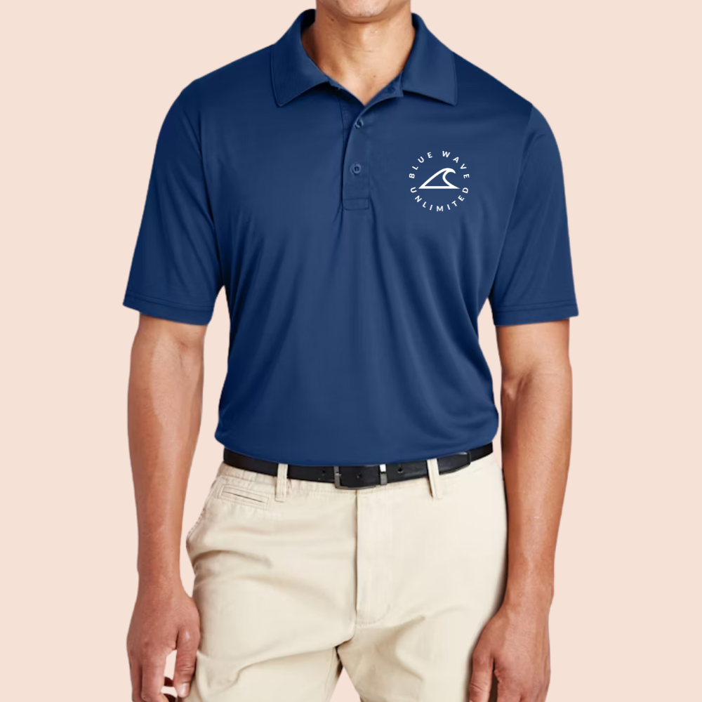 Model wearing a navy polo with a white circular company logo on the chest