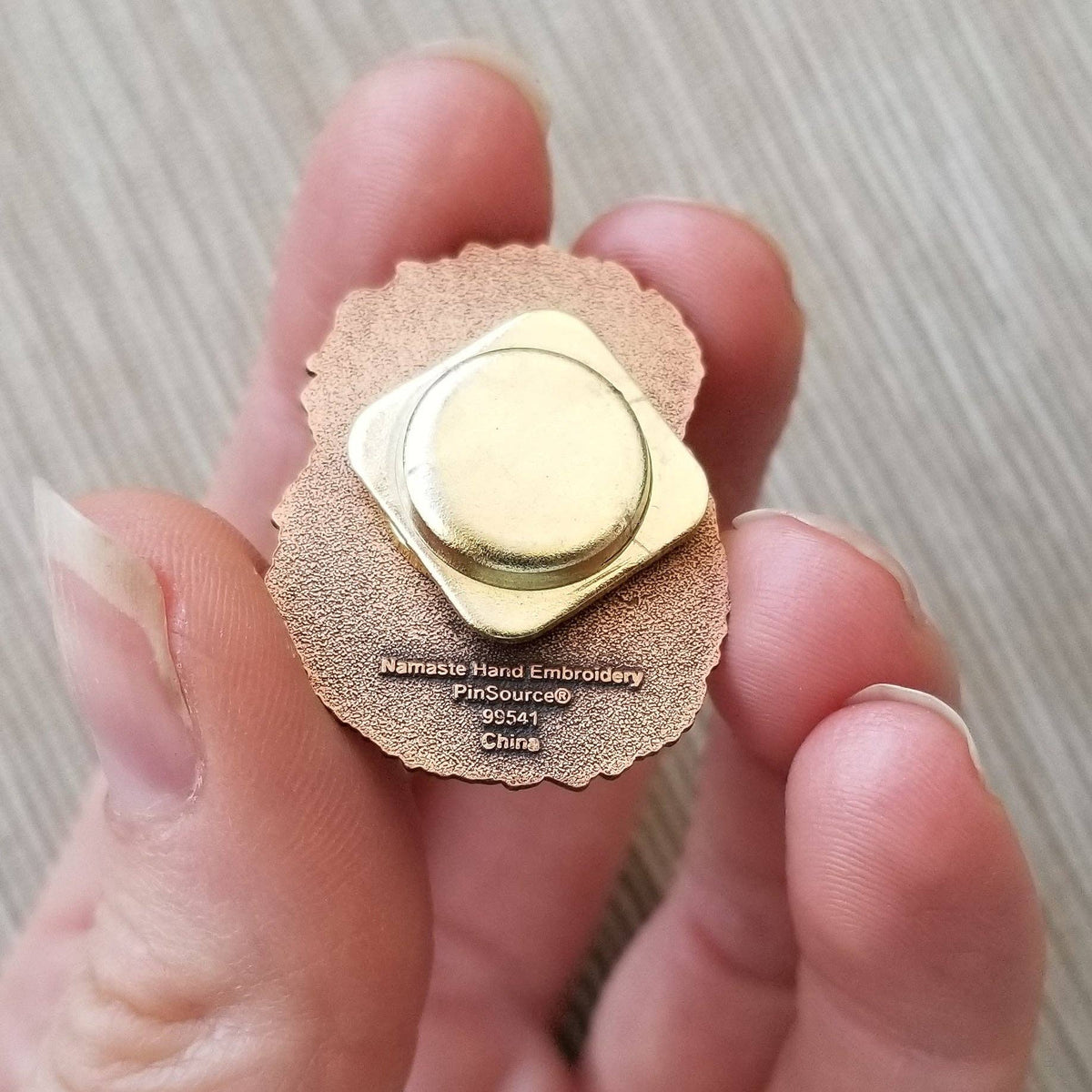 Back of the hedgehog needle minder showing its magnet backing