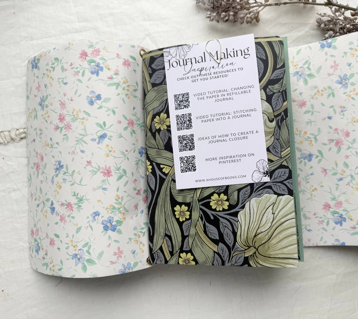 Journal Making Inspiration card with QR codes for video tutorials, tucked into a floral journal insert