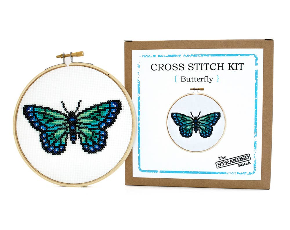 Butterfly cross stitch hoop beside The Stranded Stitch kit box