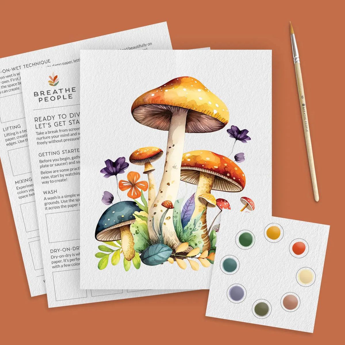 Mushroom watercolor kit: printed toadstool and wildflower outline, eight-color paint card, brush and practice sheets