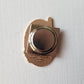 Back of the hummingbird needle minder showing its round magnet backing